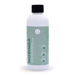 Bottle of Moringa on a white background